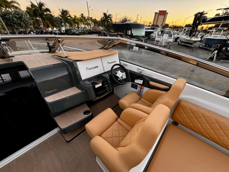 Slide: The Image of 2023 Yamarin 88 DC boat interior with tan leather seats and modern dashboard. - 22