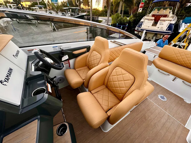Slide: The Image of Luxurious interior of 2023 Yamarin 88 DC boat with tan leather seats. - 23