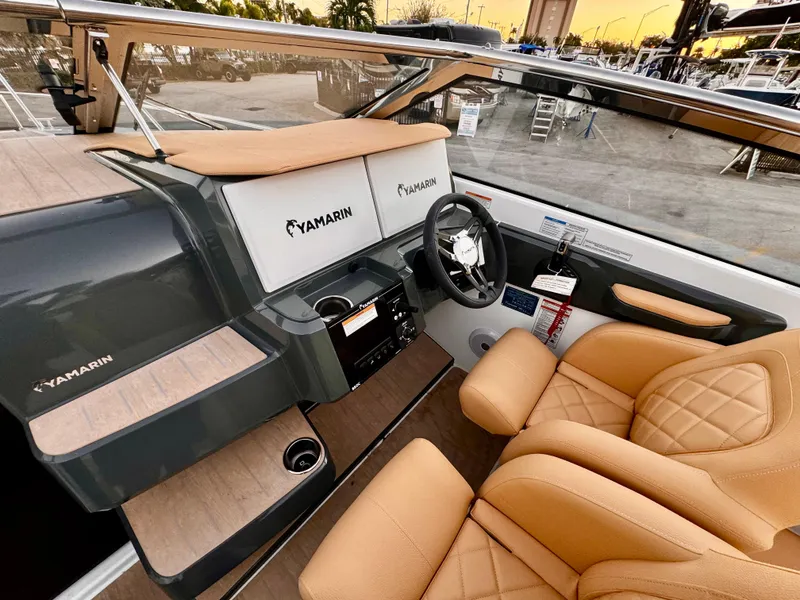 Slide: The Image of Luxurious interior of 2023 Yamarin 88 DC boat with tan leather seating and modern dashboard. - 25