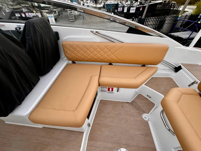 Slide: The Image of Luxurious seating on 2023 Yamarin 88 DC boat with tan upholstery and modern design. - 29