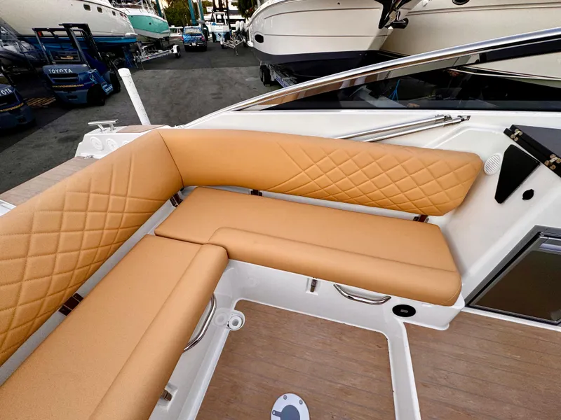 Slide: The Image of 2023 Yamarin 88 DC boat with tan leather seating and diamond stitching. - 30