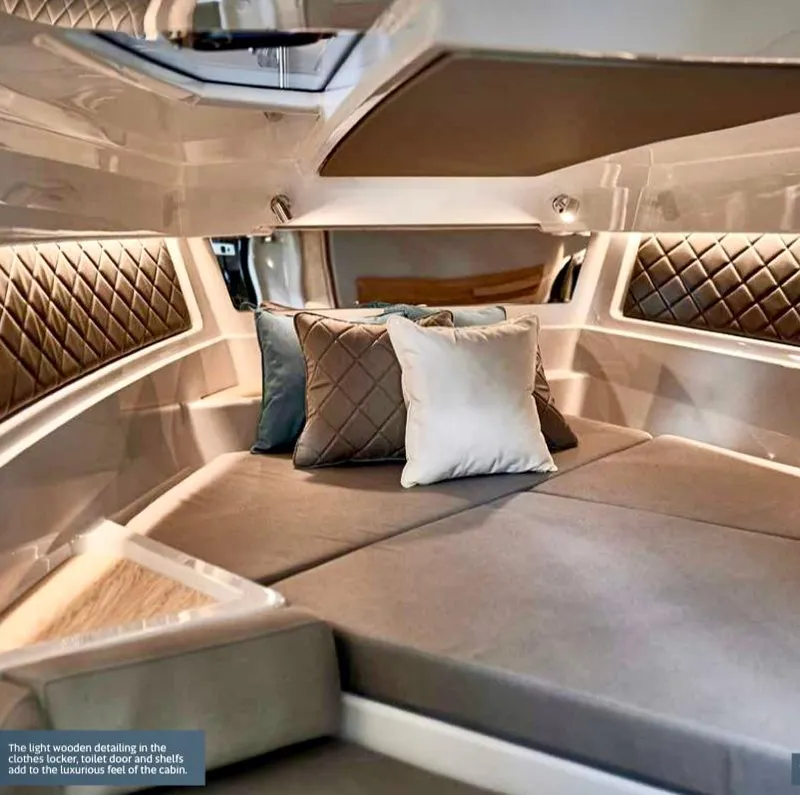 Slide: The Image of Luxurious cabin interior of 2023 Yamarin 88 DC boat with plush cushions and elegant detailing. - 31