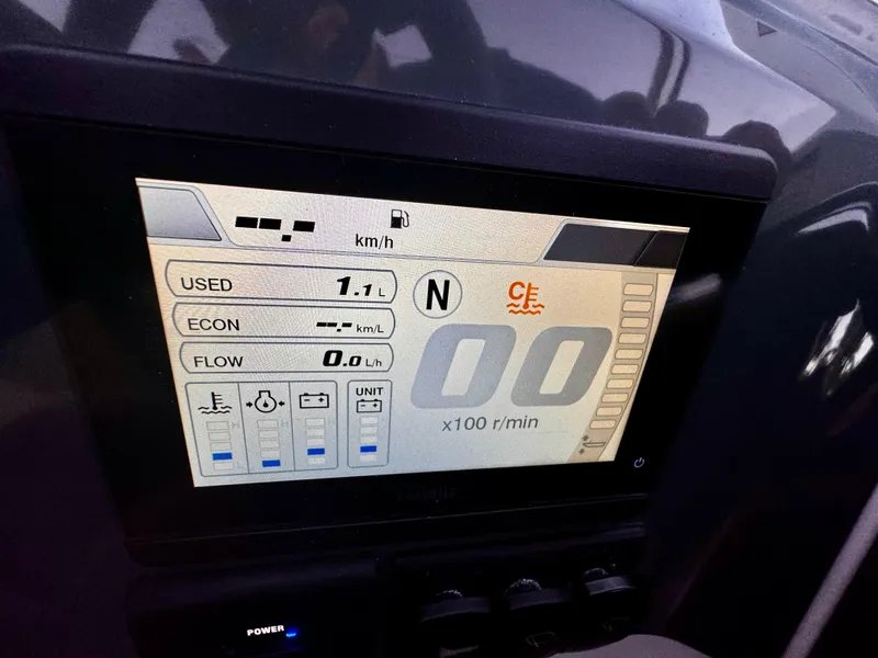 Slide: The Image of Dashboard display of 2023 Yamarin 88 DC boat showing fuel usage and RPM. - 41