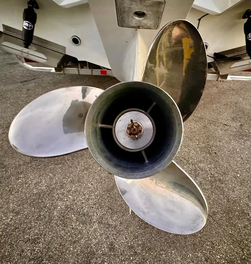 Slide: The Image of Close-up of a Yamarin 88 DC 2023 boat propeller on a concrete surface. - 47