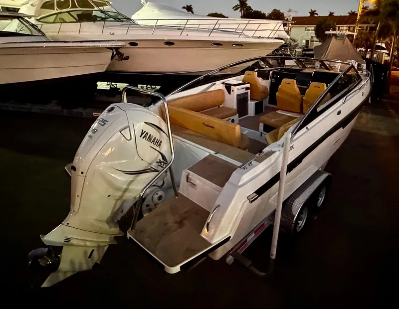 Slide: The Image of 2023 Yamarin 88 DC boat with Yamaha engine, docked at marina during evening. - 48