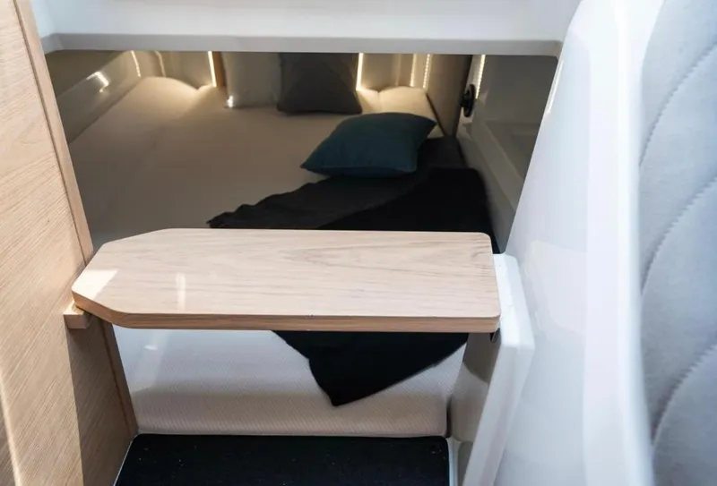 Slide: The Image of Interior cabin of 2025 Yamarin 80DC boat, featuring a cozy sleeping area. - 14