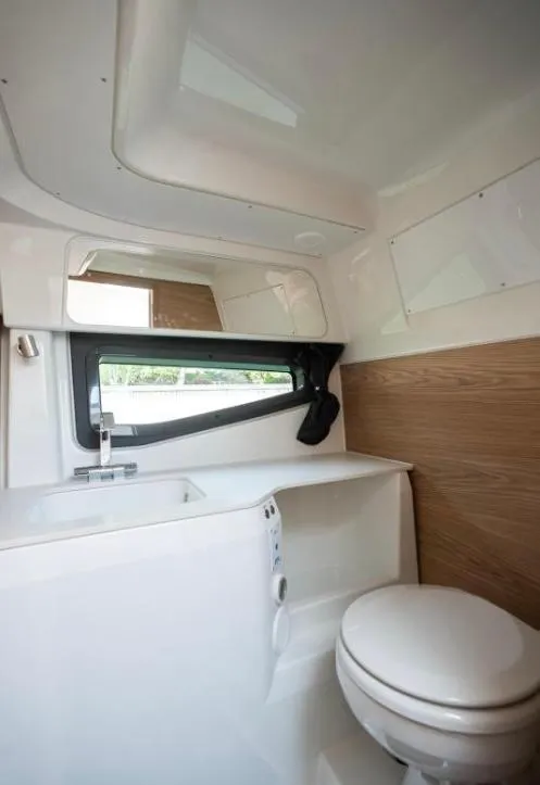 Slide: The Image of Modern bathroom interior of 2025 Yamarin 80DC boat, featuring sleek design and compact amenities. - 16