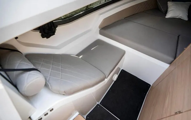 Slide: The Image of Interior of 2025 Yamarin 80DC boat, featuring modern seating and sleek design. - 17
