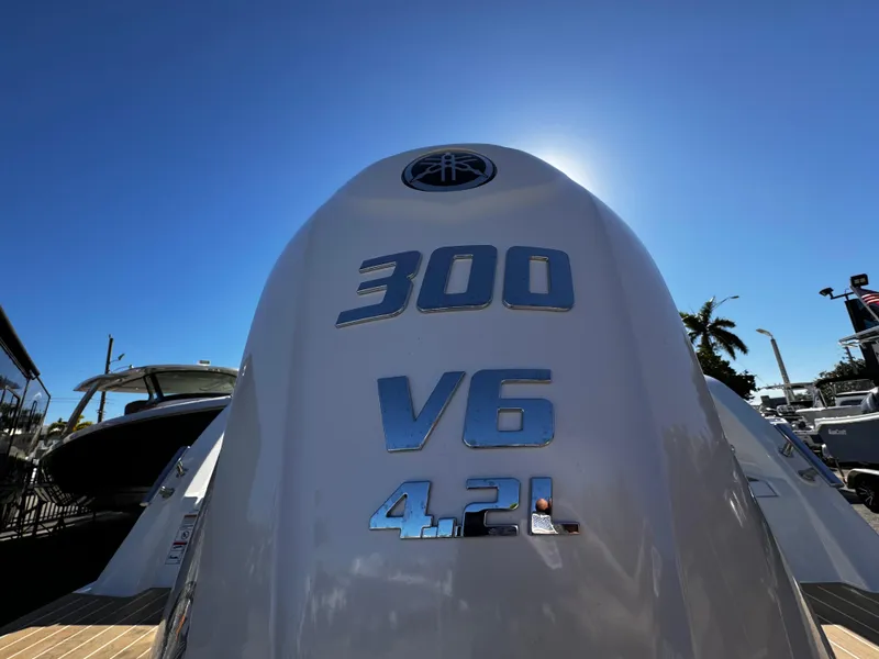 Slide: The Image of Yamarin 80DC 2025 boat engine, 300 V6 4.2L, under clear blue sky. - 25