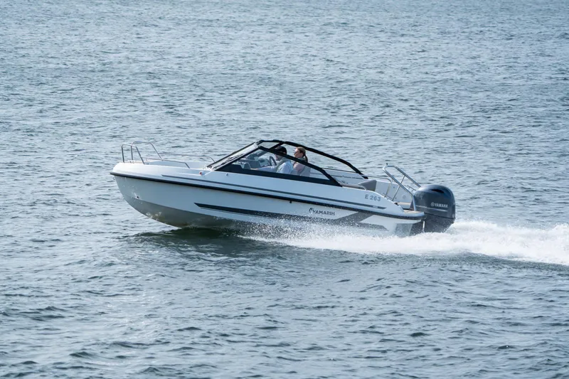 Slide: The Image of 2026 Yamarin 59 motorboat cruising on open water. - 7