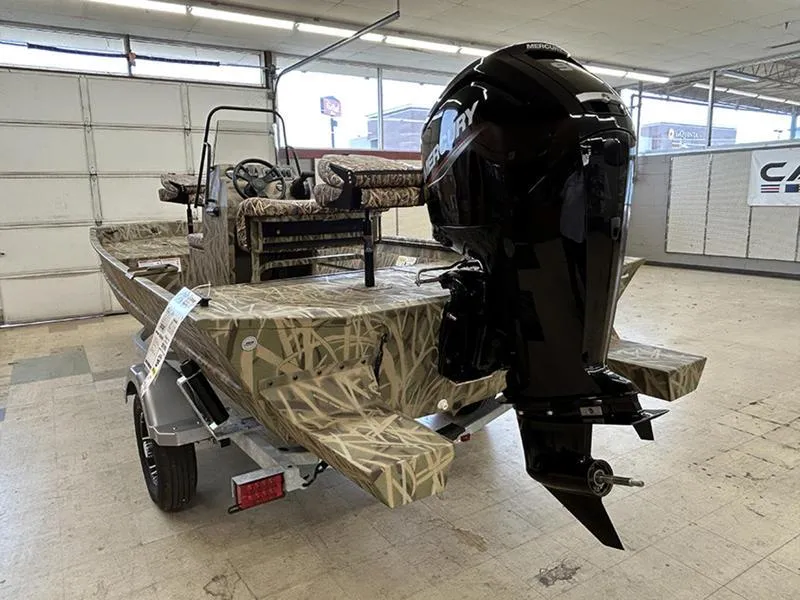 Slide: The Image of 2025 Lowe RX1860 CC boat with camouflage design and powerful outboard motor in showroom. - 1