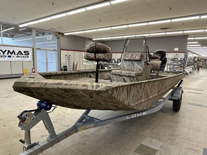 Slide: The Image of 2025 Lowe RX1860 CC boat with camouflage design on a trailer in a showroom. - 7