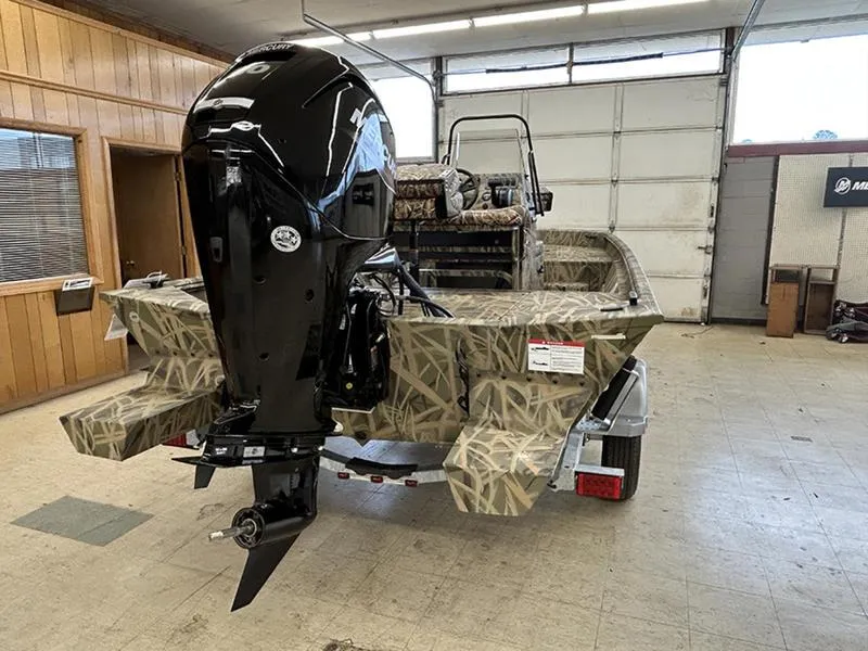 Slide: The Image of 2025 Lowe RX1860 CC boat with camouflage design in a garage setting. - 9