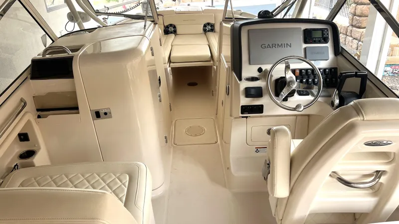 Slide: The Image of Interior of a 2021 Grady-White Freedom 275 boat with Garmin controls. - 11