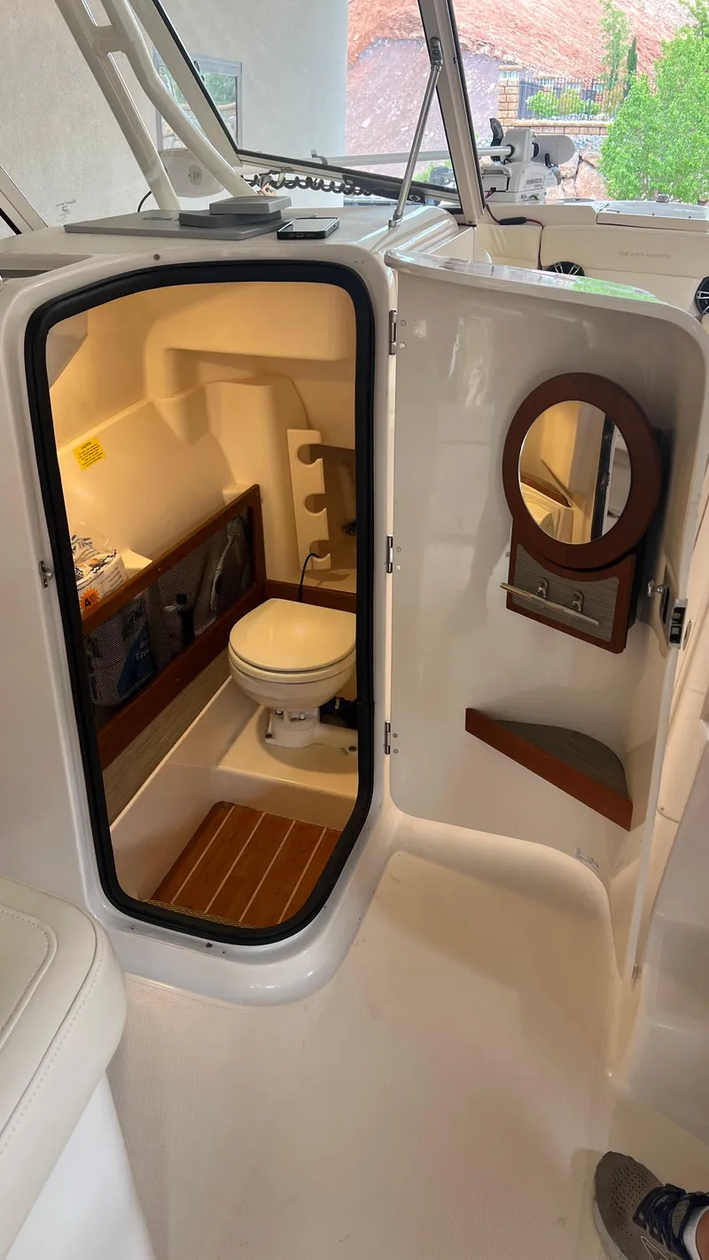 Slide: The Image of Interior view of Grady-White Freedom 275 boat toilet, 2021 model. - 30