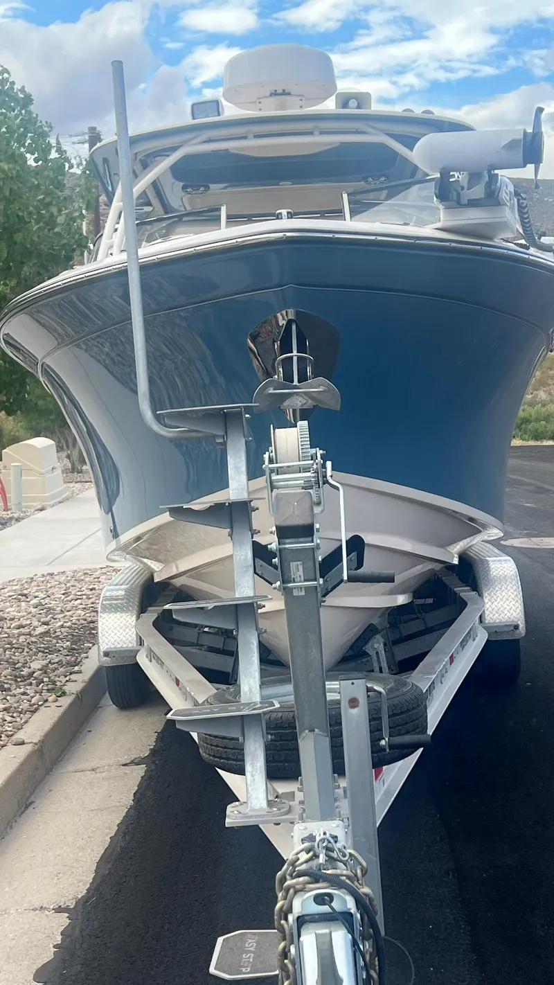 Slide: The Image of 2021 Grady-White Freedom 275 boat on a trailer. - 9
