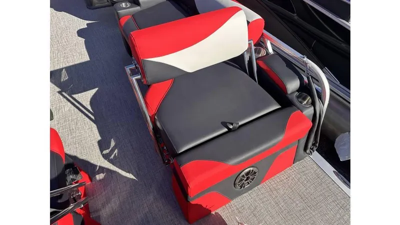 Slide: The Image of 2025 Tahoe Pontoon LTZ Quad Lounger Shift with red and black seating design. - 2