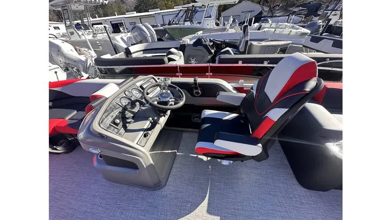 Slide: The Image of 2025 Tahoe Pontoon LTZ Quad Lounger Shift with modern helm and seating. - 6