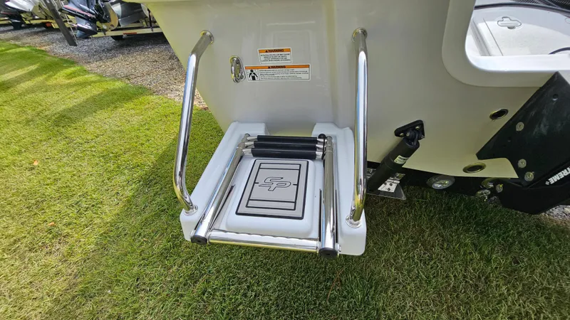 Slide: The Image of 2024 Sea Pro 210 Bay boat ladder on grass, showcasing stainless steel design. - 11