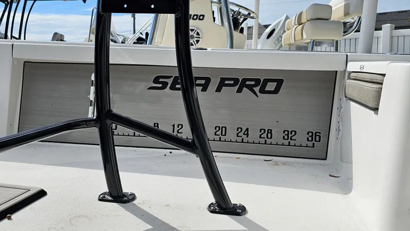 Slide: The Image of 2024 Sea Pro 210 Bay boat interior with measuring scale and seating. - 15