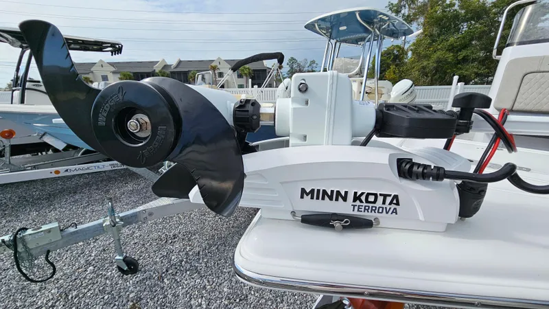 Slide: The Image of Minn Kota Terrova motor on 2024 Sea Pro 210 Bay boat, parked on gravel. - 19