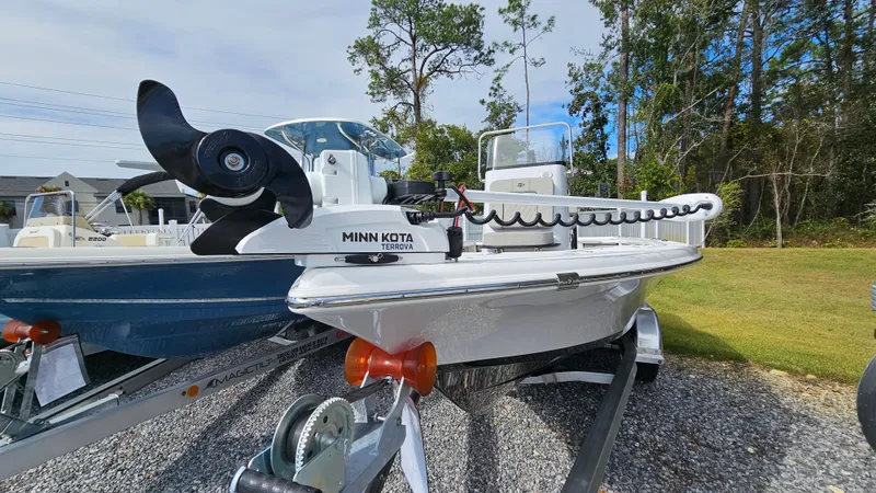 Slide: The Image of 2024 Sea Pro 210 Bay boat on trailer with Minn Kota trolling motor. - 2