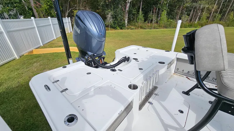 Slide: The Image of 2024 Sea Pro 210 Bay boat with Yamaha outboard motor, white deck, and seating area. - 7