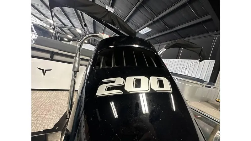 Slide: The Image of 2025 Tahoe Pontoon LTZ Versatile Rear Lounger with 200 horsepower engine in showroom. - 11