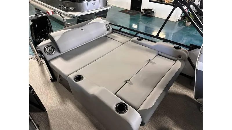 Slide: The Image of 2025 Tahoe Pontoon LTZ Versatile Rear Lounger with spacious seating and cup holders. - 2