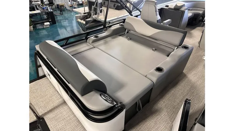 Slide: The Image of 2025 Tahoe Pontoon LTZ Versatile Rear Lounger with gray seating and cup holders. - 5