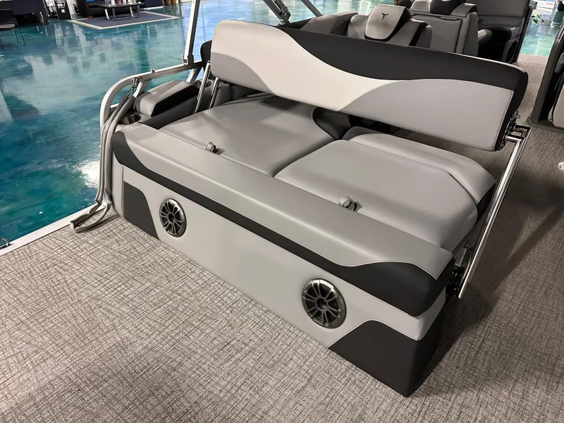 Slide: The Image of 2025 Tahoe Pontoon LTZ Cruise Rear Bench with sleek gray seating and integrated speakers. - 4