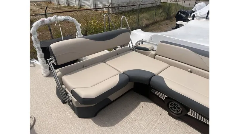 Slide: The Image of 2025 Tahoe Pontoon LTZ Cruise Rear Bench with beige and gray seating. - 6