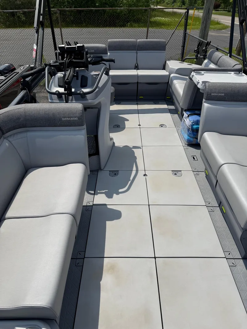 Slide: The Image of 2022 Sea-Doo Switch Cruise 18' boat interior with spacious seating and modern design. - 4