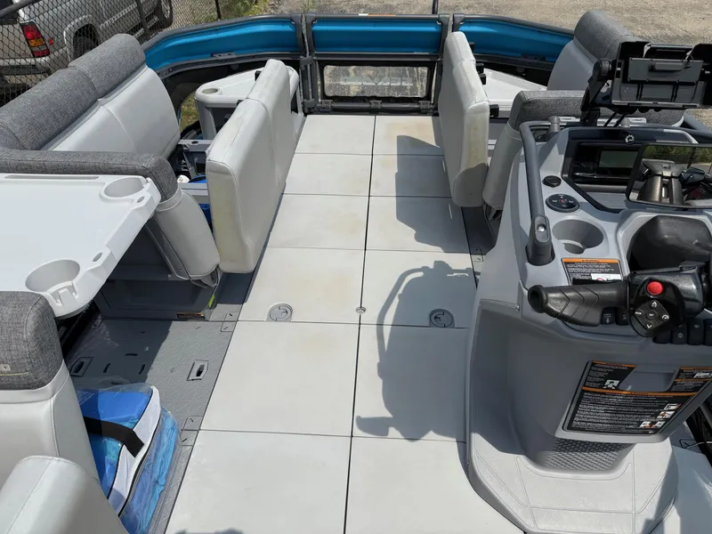 Slide: The Image of 2022 Sea-Doo Switch Cruise 18' interior with seating and control console, showcasing spacious layout. - 6