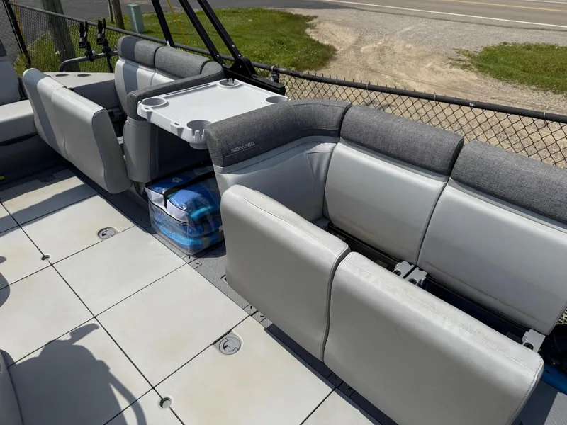 Slide: The Image of 2022 Sea-Doo Switch Cruise 18' interior with gray seating and table setup. - 7