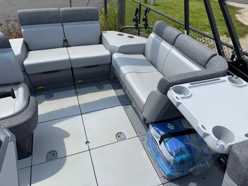 Slide: The Image of 2022 Sea-Doo Switch Cruise 18' interior with gray seating and table. - 8