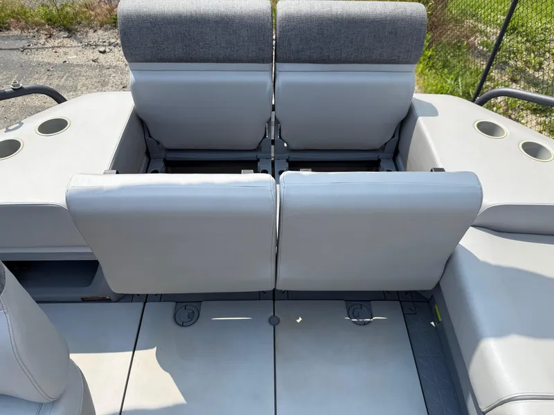 Slide: The Image of 2022 Sea-Doo Switch Cruise 18' interior seating with cup holders, gray upholstery. - 9