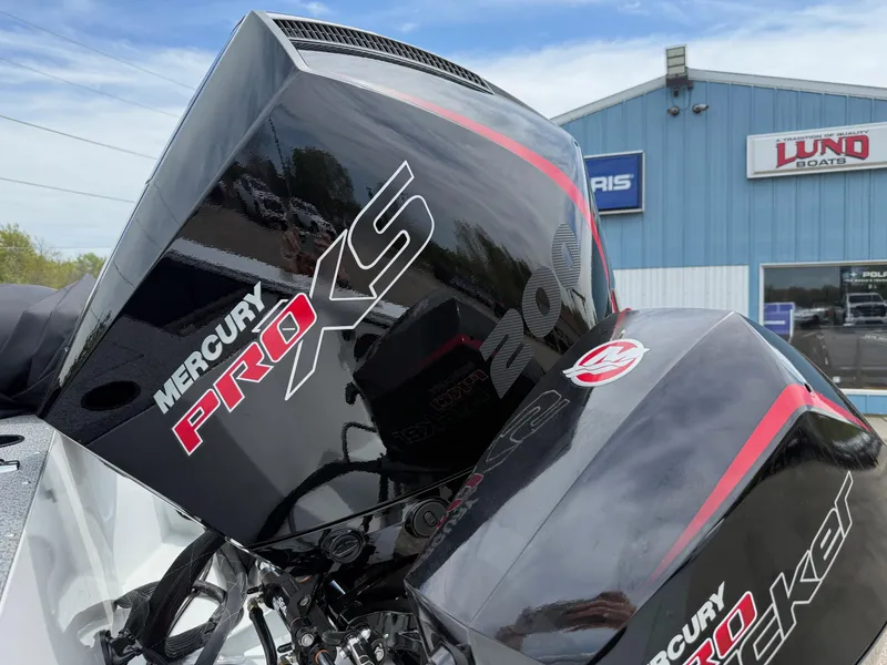 Slide: The Image of Mercury Pro XS engine on 2025 Lund Fisherman 2075 boat at dealership. - 10