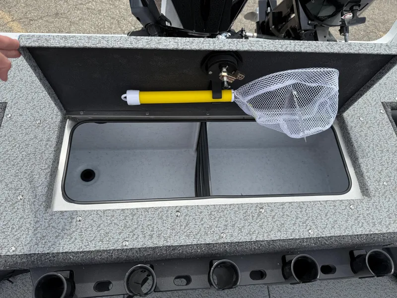 Slide: The Image of 2025 Lund Fisherman 2075 boat livewell with net and rod holders. - 15