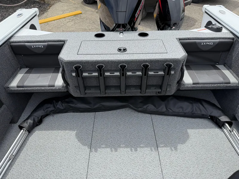 Slide: The Image of 2025 Lund Fisherman 2075 boat interior with seating and rod holders. - 16