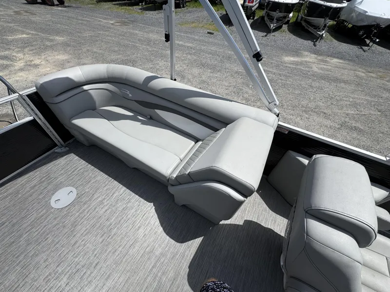 Slide: The Image of 2022 Bennington 22 SSR boat interior with gray seating and flooring. - 17