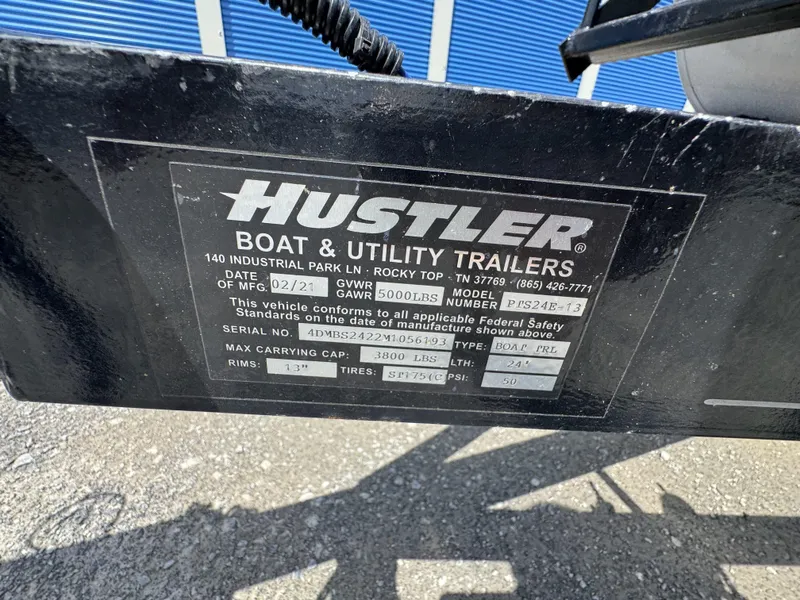Slide: The Image of Label on Hustler boat trailer, model P/S24E-13, with specifications and manufacturing details. - 21