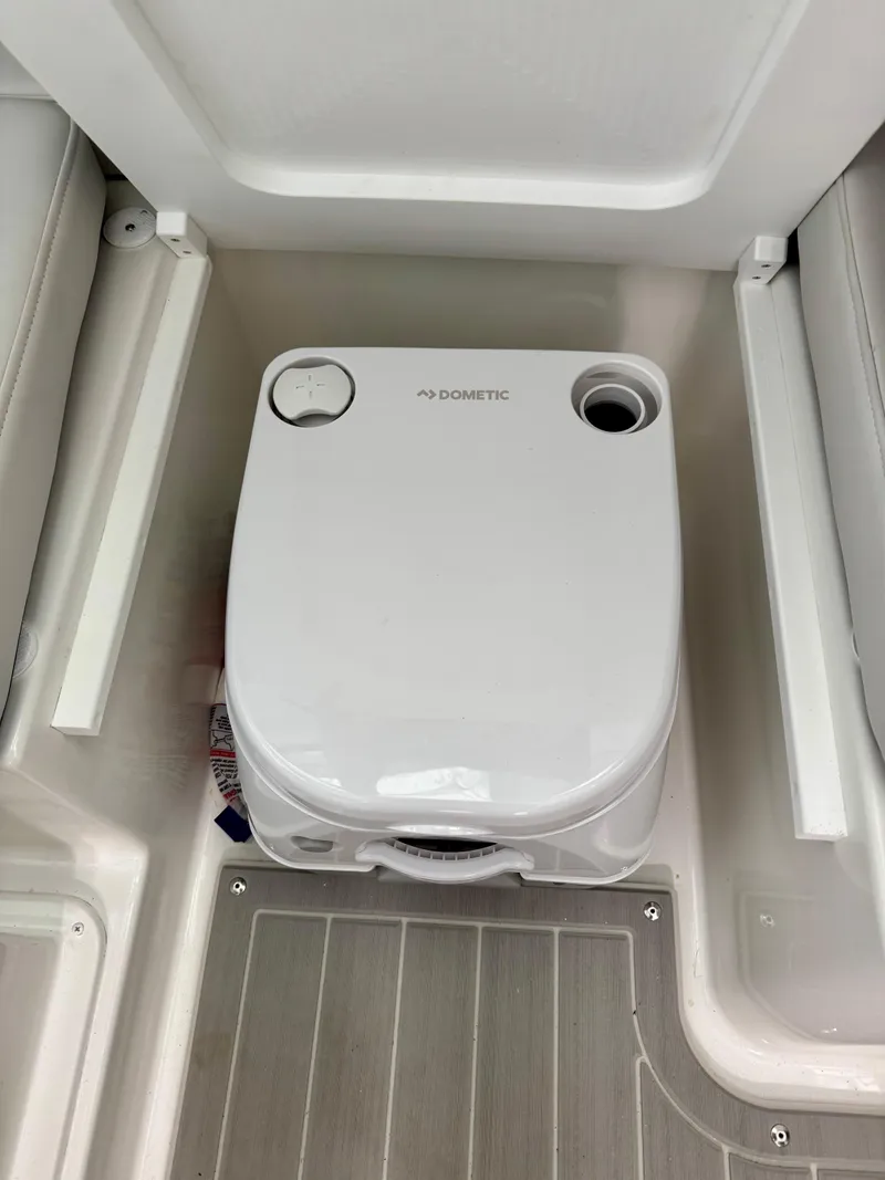 Slide: The Image of Portable toilet in 2025 Parker 2420 Sport Cabin boat interior. - 17