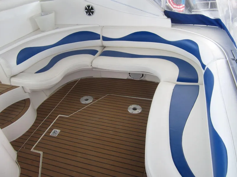 Slide: The Image of Luxurious seating area on 2000 Cruisers Yachts 4270 Express with blue and white upholstery. - 10