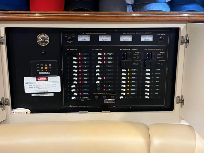 Slide: The Image of Electrical control panel inside a 2000 Cruisers Yachts 4270 Express. - 34