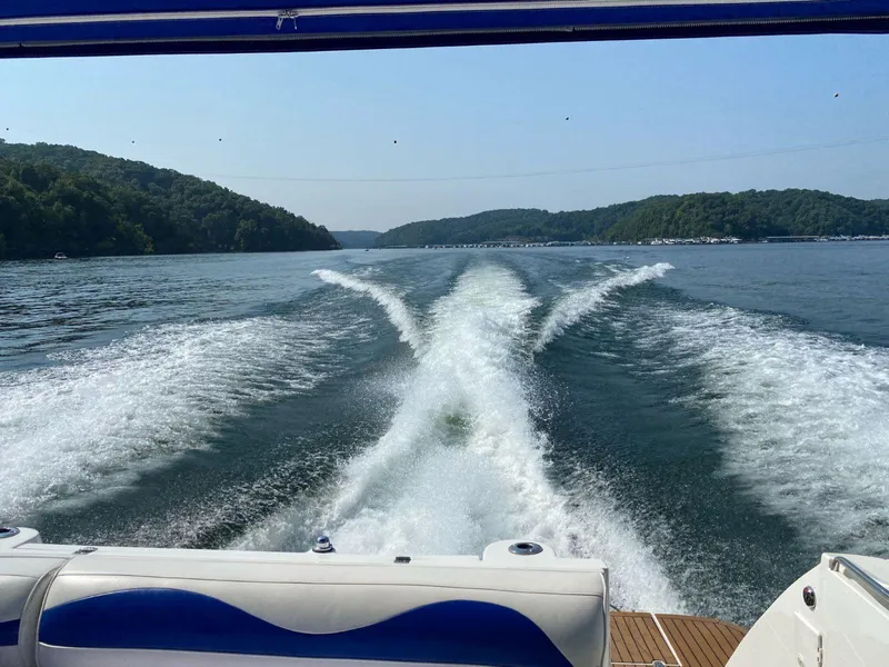 Slide: The Image of Wake of 2000 Cruisers Yachts 4270 Express on a scenic lake. - 6