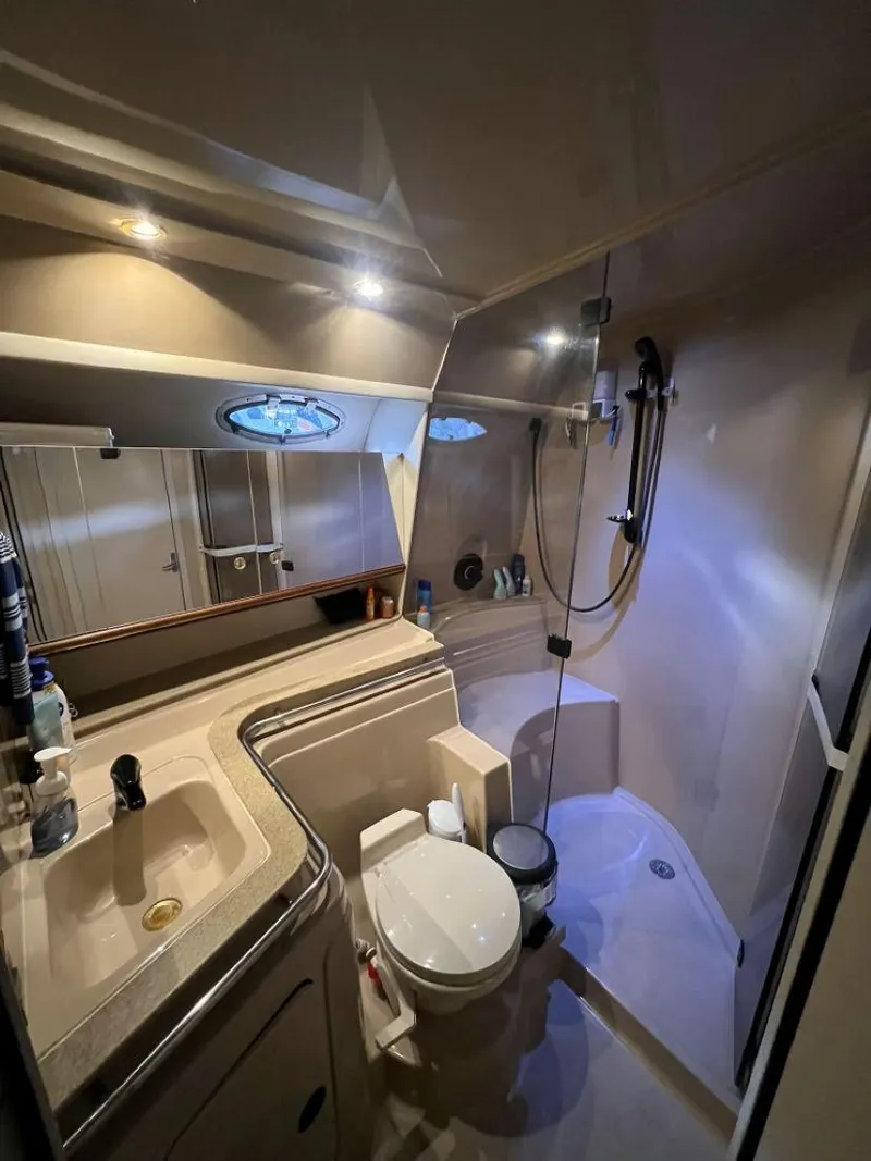 Slide: The Image of Bathroom interior of 2000 Cruisers Yachts 4270 Express with shower and sink. - 21
