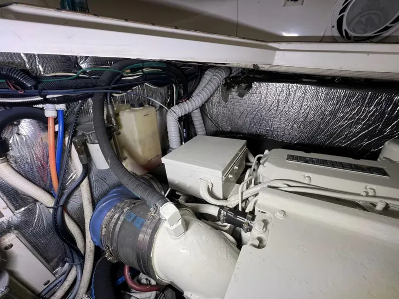 Slide: The Image of Engine room of 2000 Cruisers Yachts 4270 Express with visible wiring and components. - 45