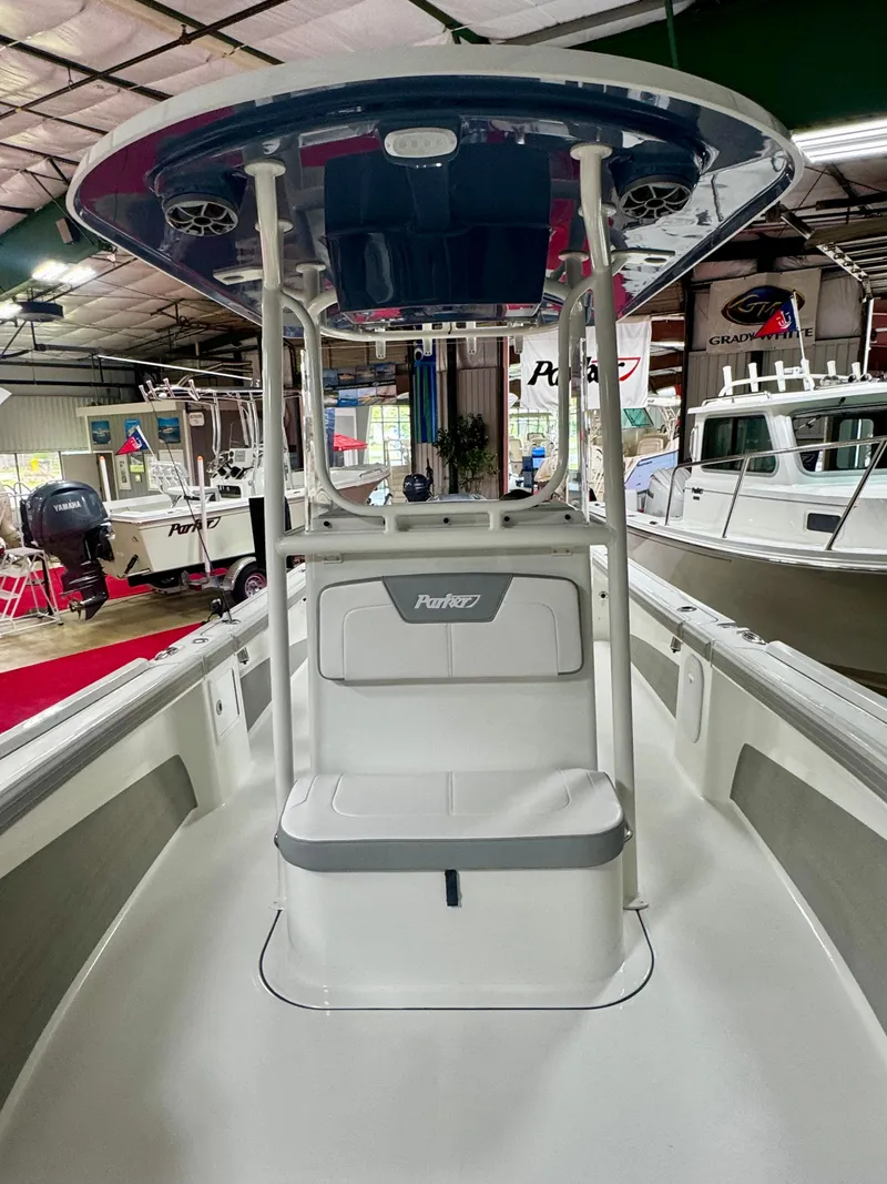 Slide: The Image of 2025 Parker 23SE Center Console boat displayed in a showroom. - 11