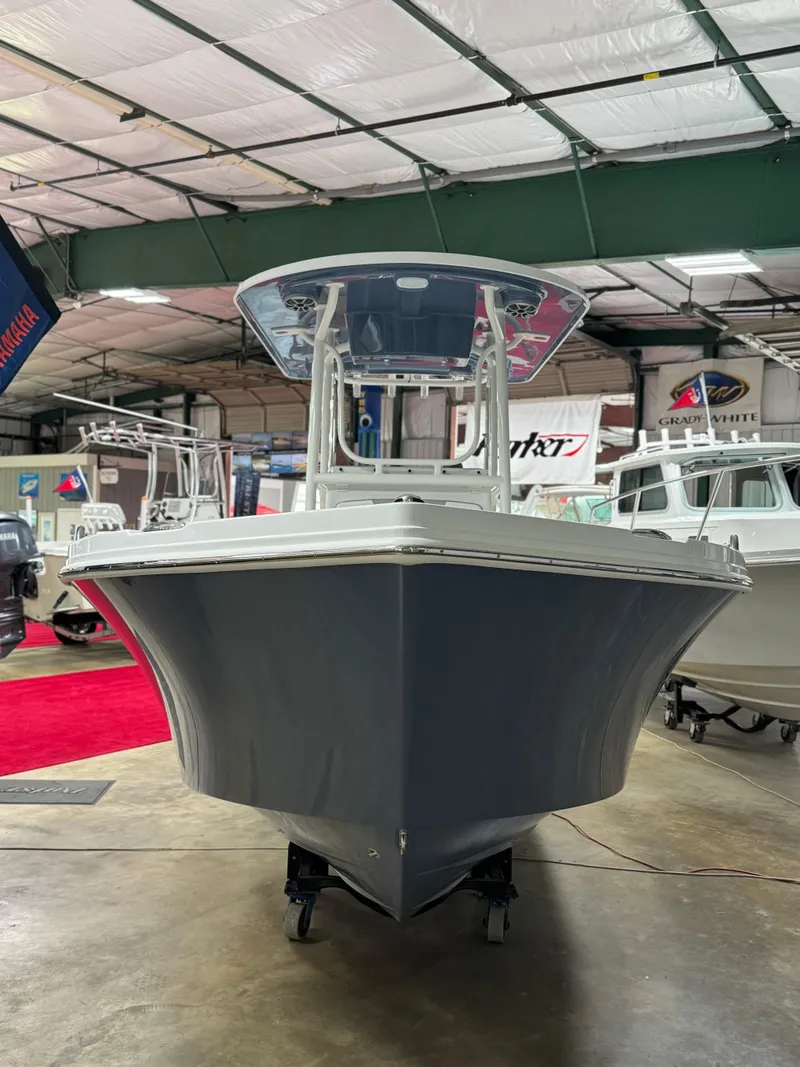 Slide: The Image of 2025 Parker 23SE Center Console boat in showroom, front view. - 4